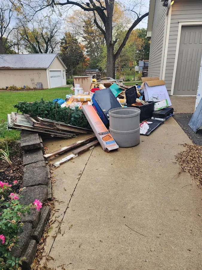 Dumpster being loaded with debris for 3 Yard Dumpster Rental in Brices Creek